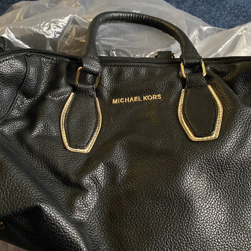 Used Micheal Koris Pocketbook, hardly used.
